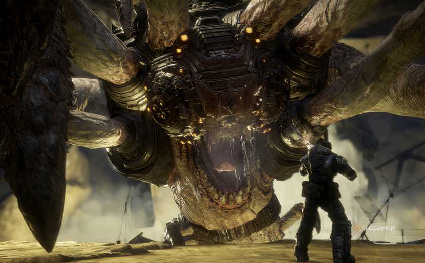The Corpser hanging on a ledge while the player looks onward in Gears of War: Reloaded.