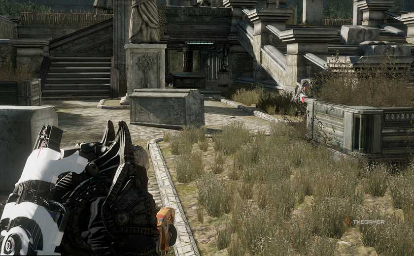 The player engaging another player in Gears of War: Reloaded who is behind a cover. 